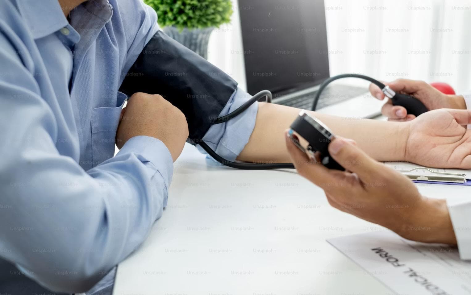 A blood pressure check during chronic disease management follow-up.