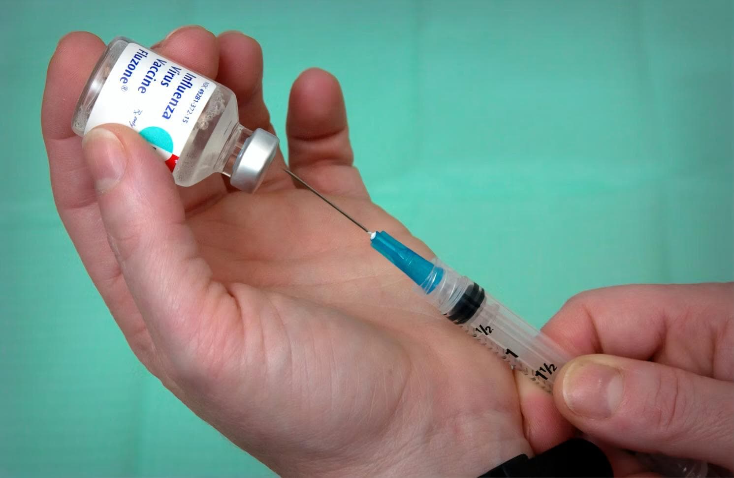 A vaccine being prepared for immunization and preventive care.